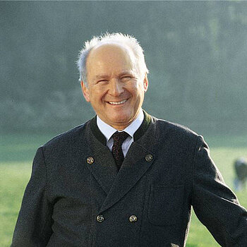 Claus Hipp smiling in nature